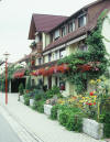 A typical middle class multi-family residence. Many residences are adorned with real flowers.